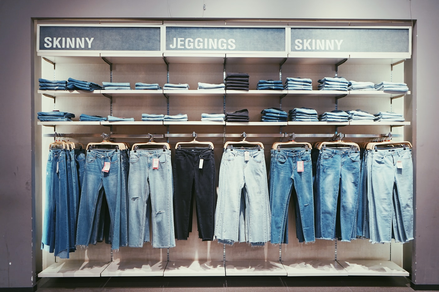 Folded denim on retail shelving
